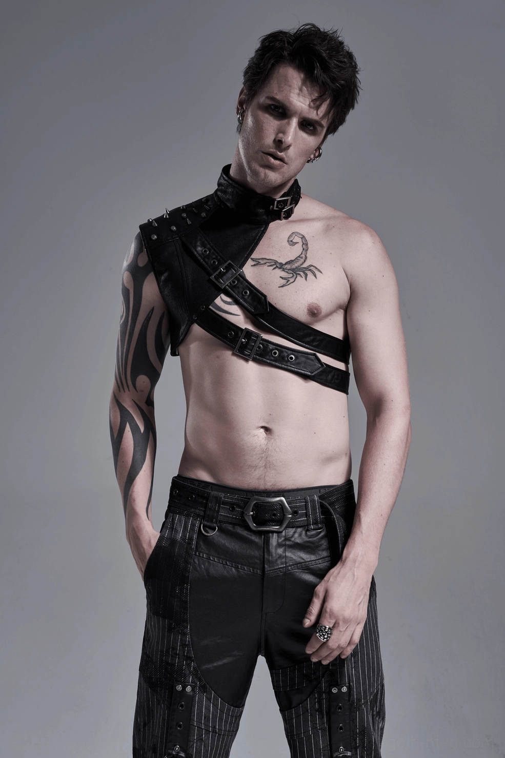 Gothic leather harness with metal rivets - detail shot showing industrial design elements and construction quality