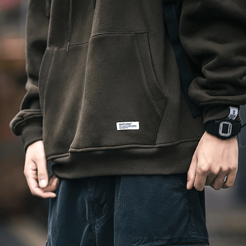 Dark gray gothic hoodie on model showing contemporary alternative street style