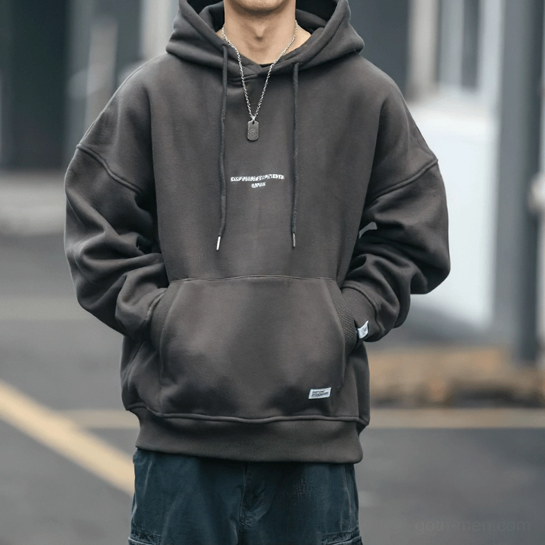 Men's gothic hoodie styling detail showing drawstring hood closure and fabric texture