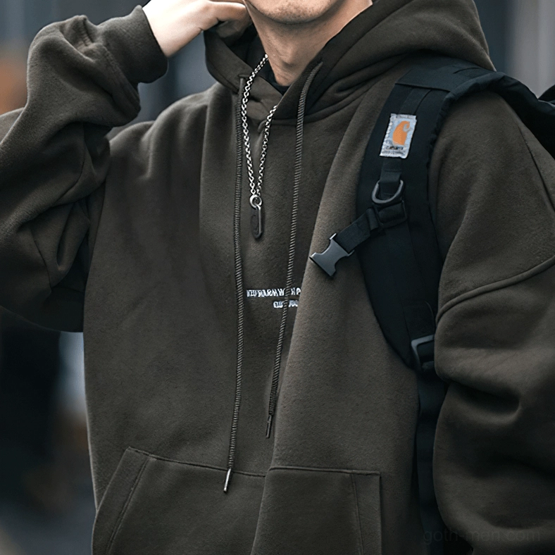 Light gray gothic letter hoodie on model demonstrating oversized relaxed fit