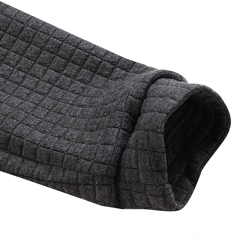 Ribbed cuff detail of quilted gothic hoodie showing dark gray fabric texture and stitching quality