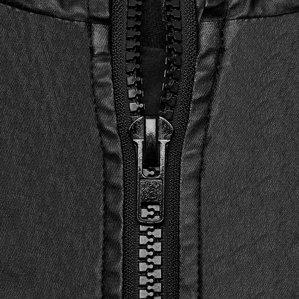 Heavy-duty black plastic zipper and metal puller detail on gothic techwear sleeveless hoodie
