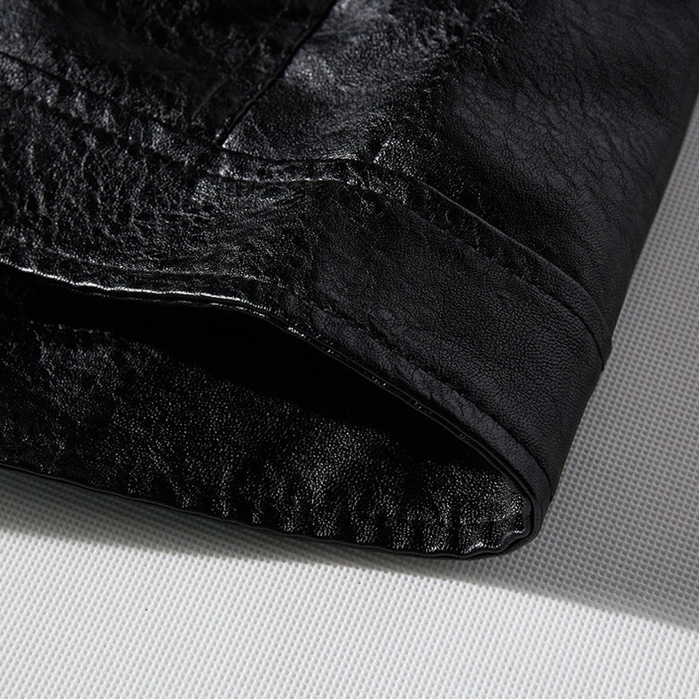 Close-up of PU leather jacket cuff and hem with visible stitching and polyester lining detail