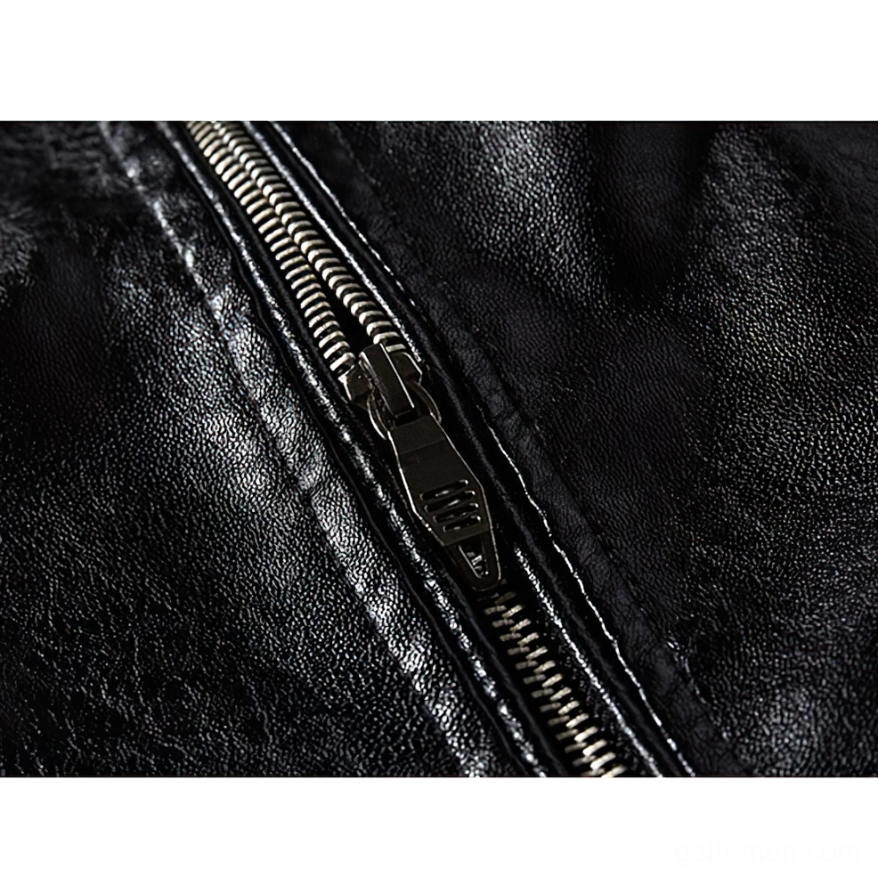 Close-up detail of silver metal zipper with stitched leather trim on gothic biker jacket