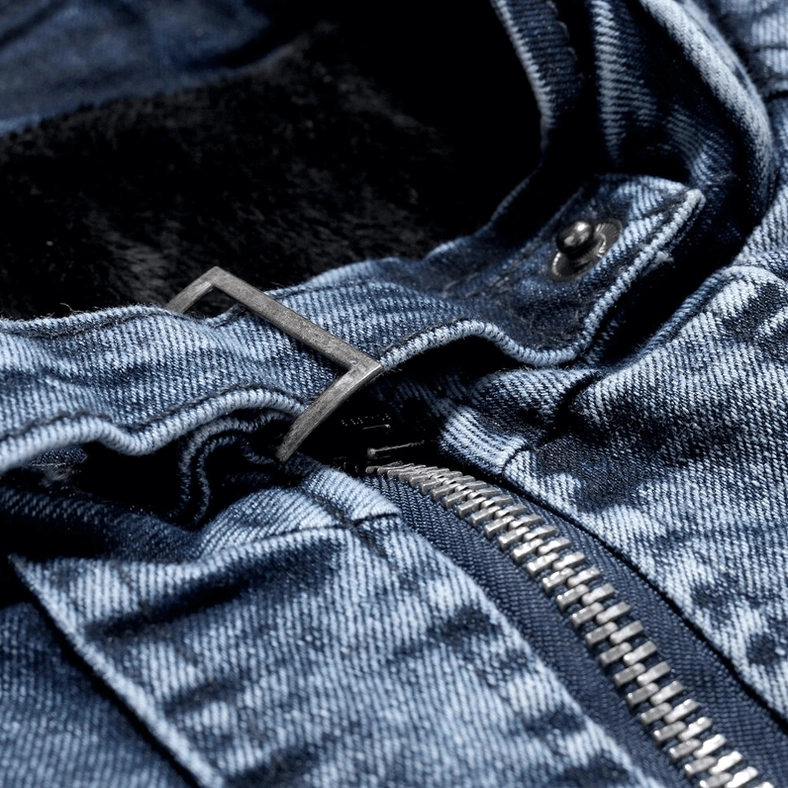 Denim biker jacket metal zipper placket detail showing premium hardware and luxurious fuzzy interior lining