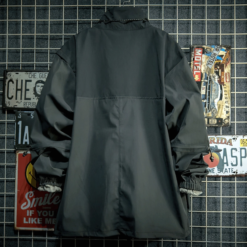 Detailed view of gothic jacket shoulder seam and metal zipper tape showing quality stitching construction