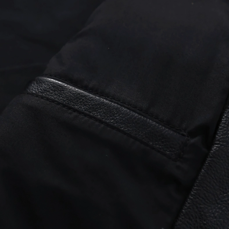 Sleeve seam and hidden pocket trim detail on black leather gothic biker jacket