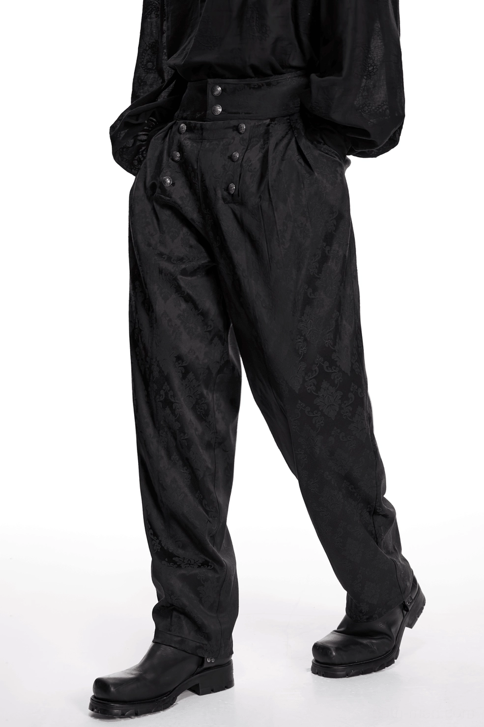 Black gothic jacquard tapered trousers garment construction showing seam precision and inelastic fabric