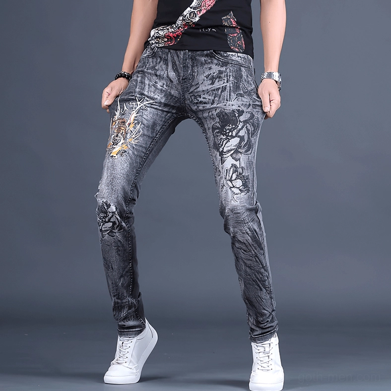 Front view of gothic embroidered denim jeans with floral embroidery design on thighs and legs
