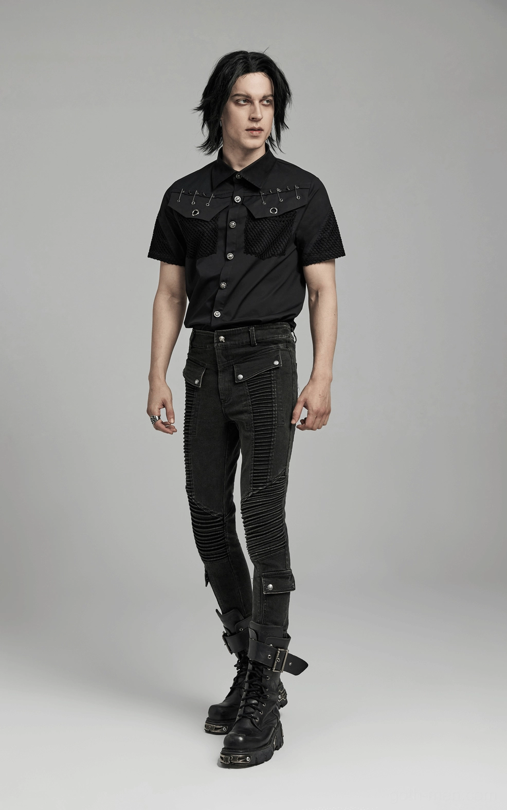 Black gothic denim jeans ribbed knee panel close-up - architectural textile design and construction