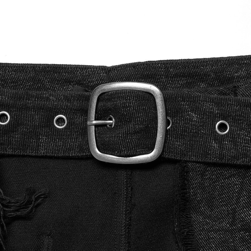 Close-up detail of gothic kilt metal square buckle, waist eyelets, and cracked black textured fabric