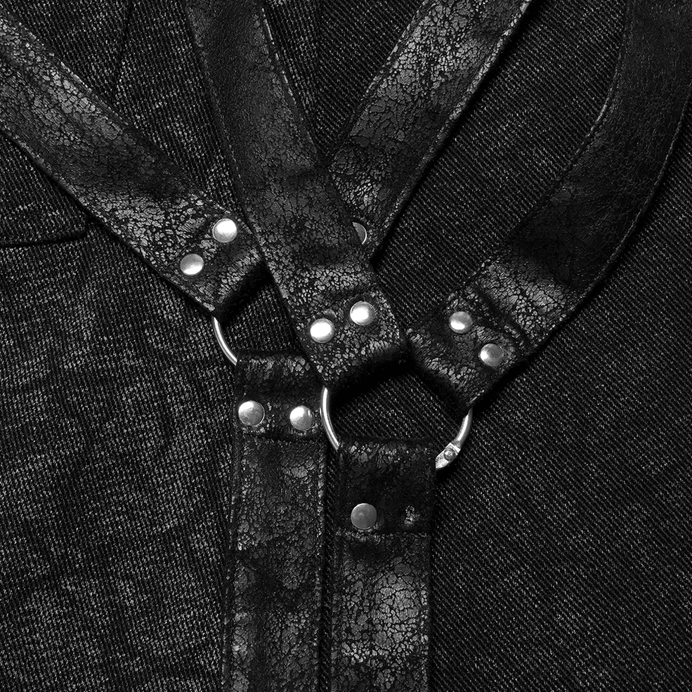 Detailed close-up of gothic kilt harness straps showing metal D-rings, rivets, and layered textured construction