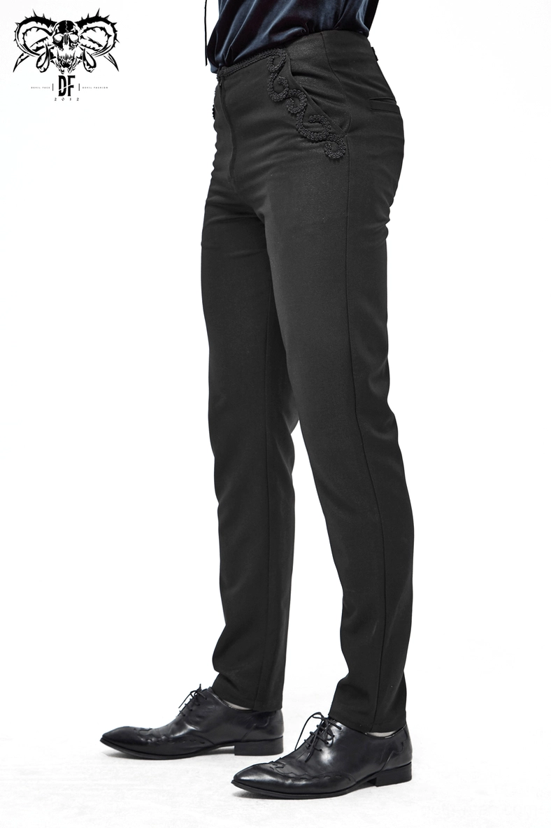 Styled shot of black gothic cargo pants highlighting fabric drape and pocket embroidery
