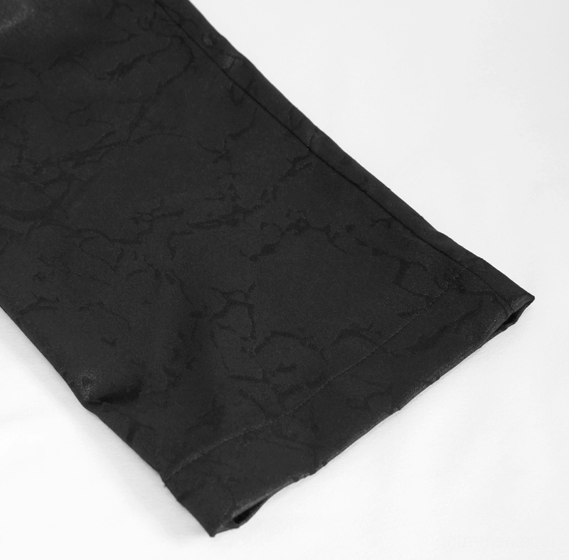 Black gothic cargo pants hem detail showing straight-cut edge and matte black jacquard fabric texture