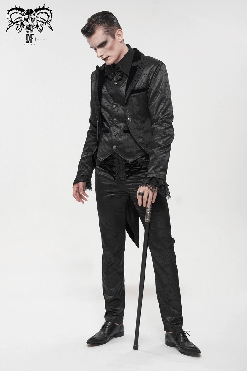 Black gothic lace-up cargo pants demonstrating intricate jacquard pattern and velvet trim on professional model