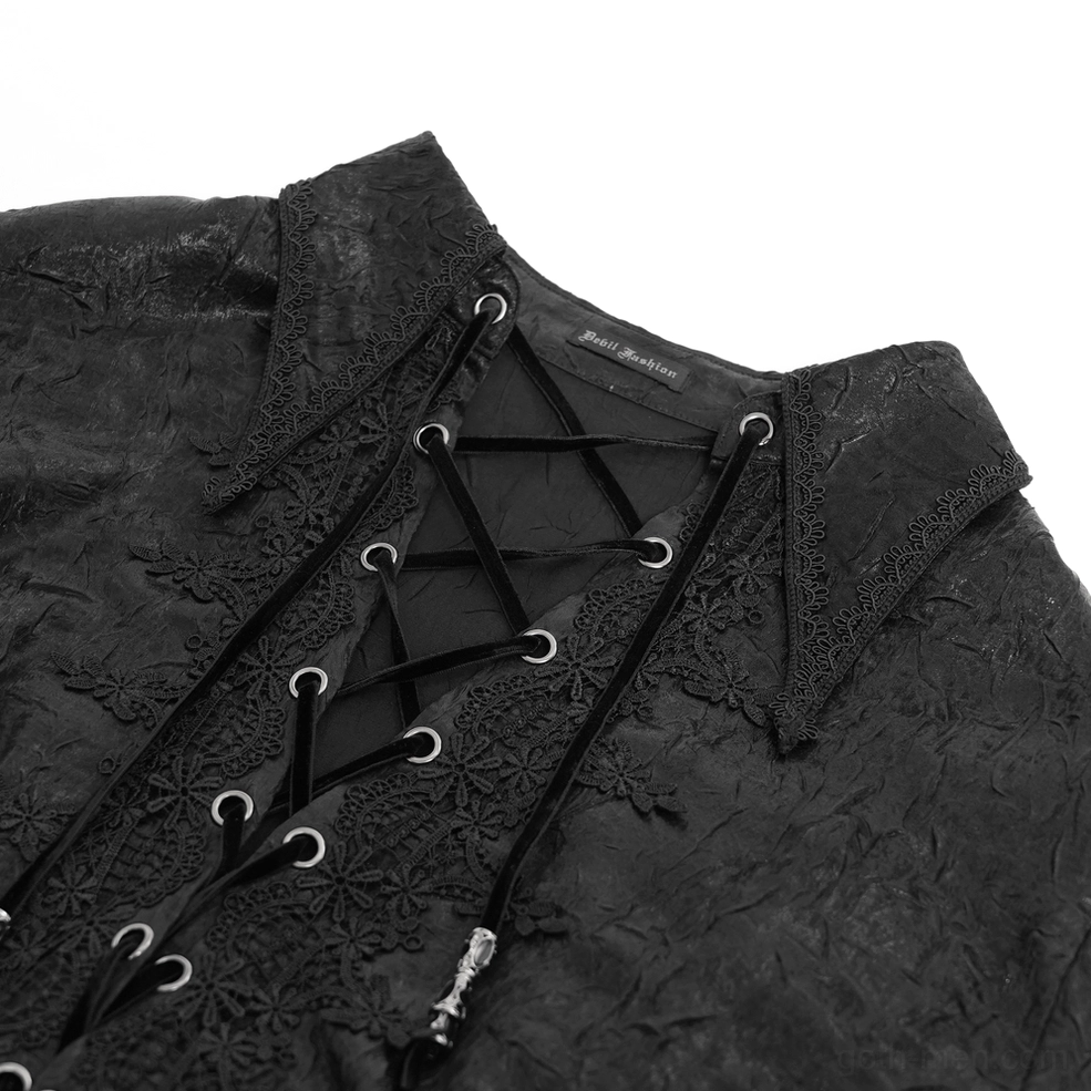 Close-up detail of gothic shirt floral lace trim and metal eyelet lace-up system