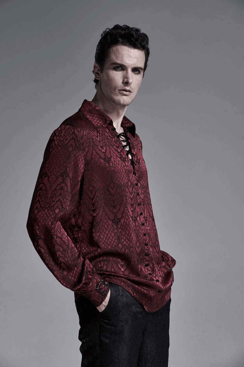 Men's gothic lace-up shirt sleeve and cuff detail showing gathered fabric texture and metal buckle fastening