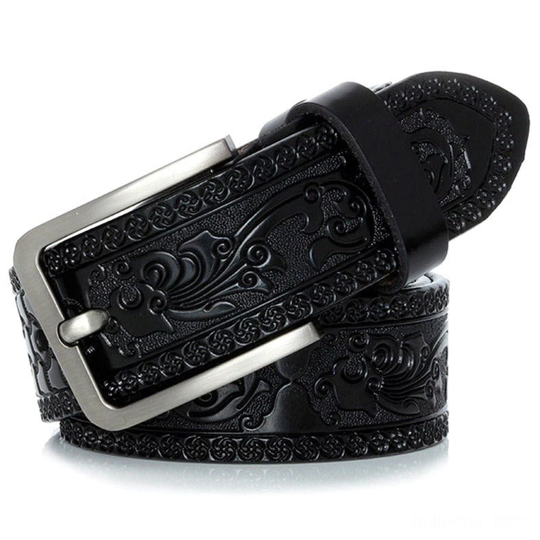 Black embossed gothic leather belt with intricate carved floral design and silver metal buckle, side detail view