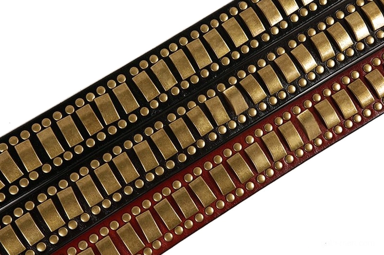 Gothic leather belt with geometric bronze rivet pattern, full width view
