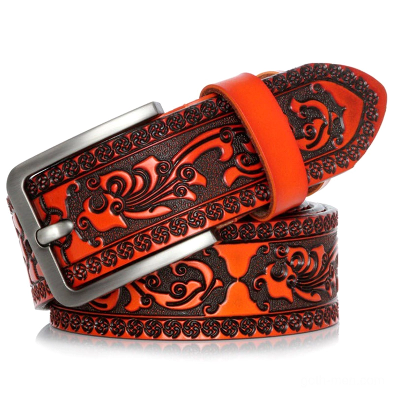 Golden brown vintage embossed leather belt for men with ornate gothic pattern and adjustable buckle
