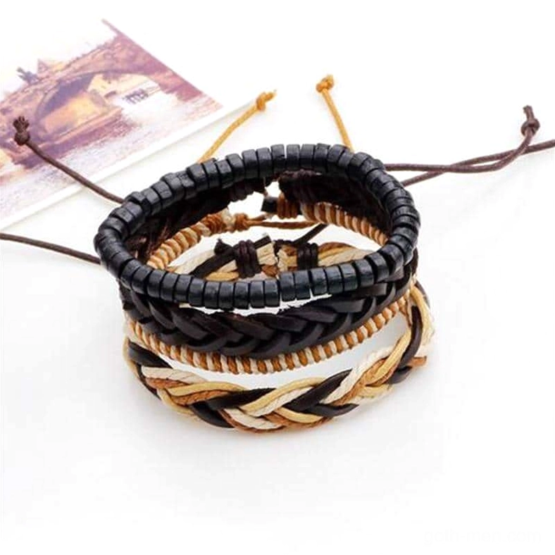 Close-up overhead view of braided leather gothic bracelets with adjustable drawstring closures and two-tone woven pattern