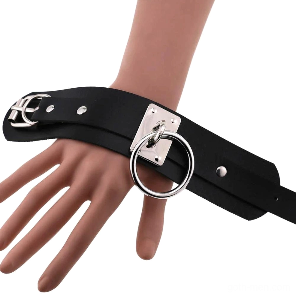 Close-up view of gothic leather cuff bracelet silver metal rings and leather craftsmanship
