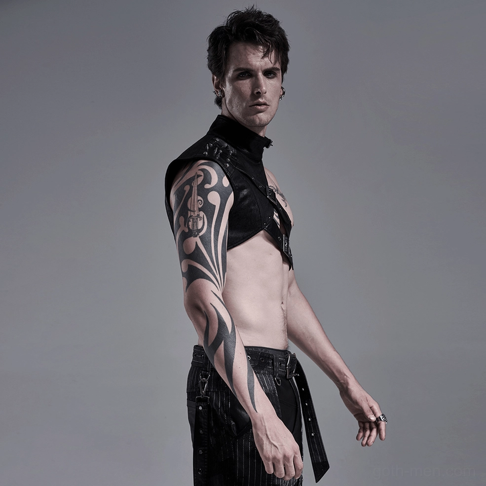 Gothic one-shoulder leather harness styling - alternative fashion model wearing asymmetrical design