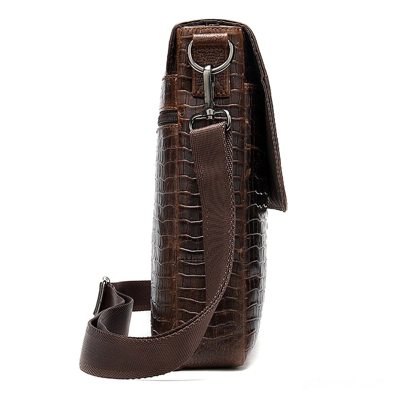 Gothic leather messenger bag side view - woven shoulder strap with metal hanging buckles and crocodile embossing