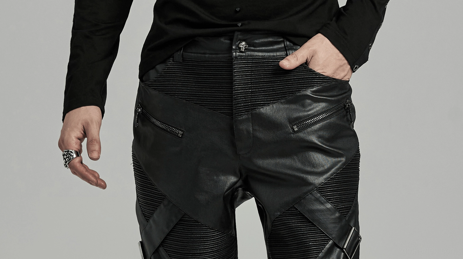 Back quarter angled view of gothic leather pants showing rear silhouette and structured construction details