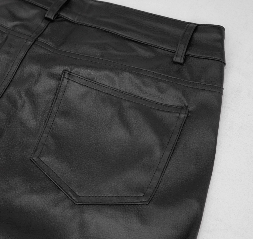 Front close-up detail of black gothic leather pants back pocket showing stitched square pocket design and waist belt loop construction
