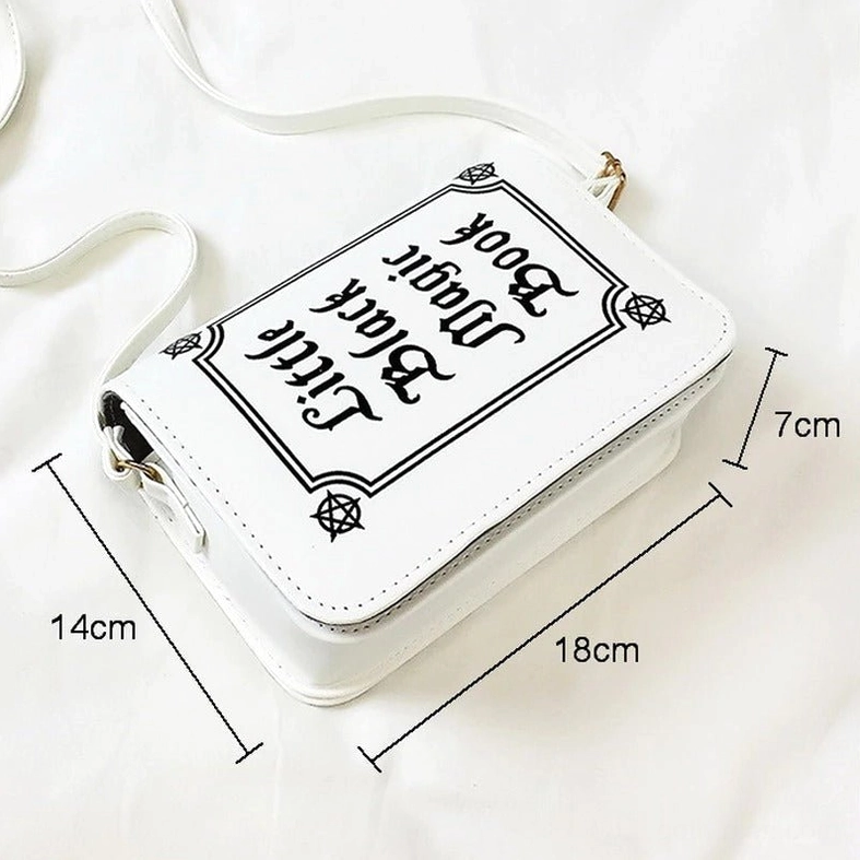 White gothic letter shoulder bag with 18x14x7cm dimensions marked on white bedding background