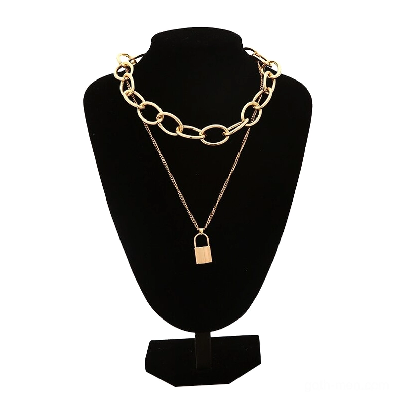 Gold-toned gothic lock pendant necklace with layered chain set on black jewelry mannequin