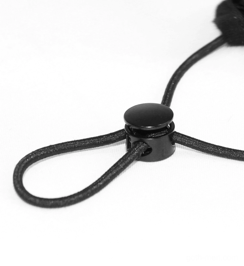 Black plastic cord lock adjuster for spiderweb gothic mask ear straps, macro close-up detail