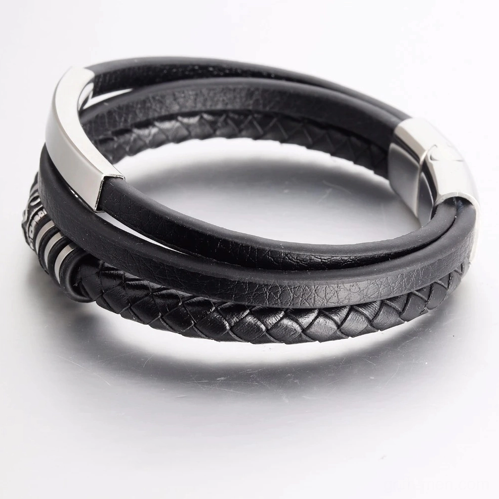 Black leather men's bracelet with polished silver ends and woven detail - angled perspective