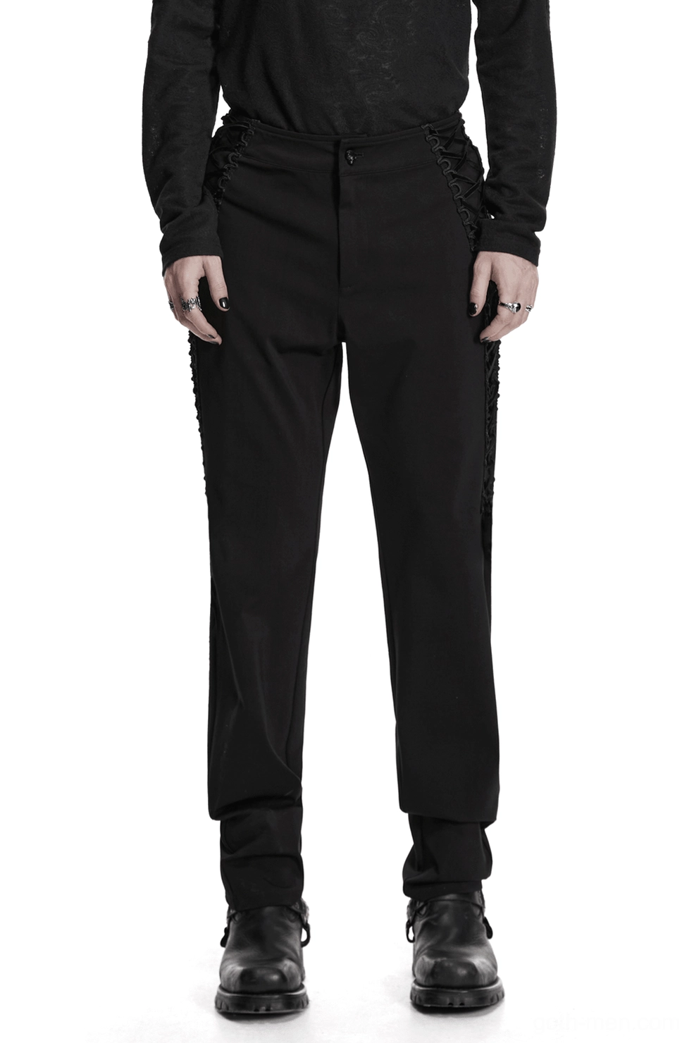 Man wearing gothic high-waist black slim pants with side lace-up detail, front full-body view showing tapered fit and elevated waistline