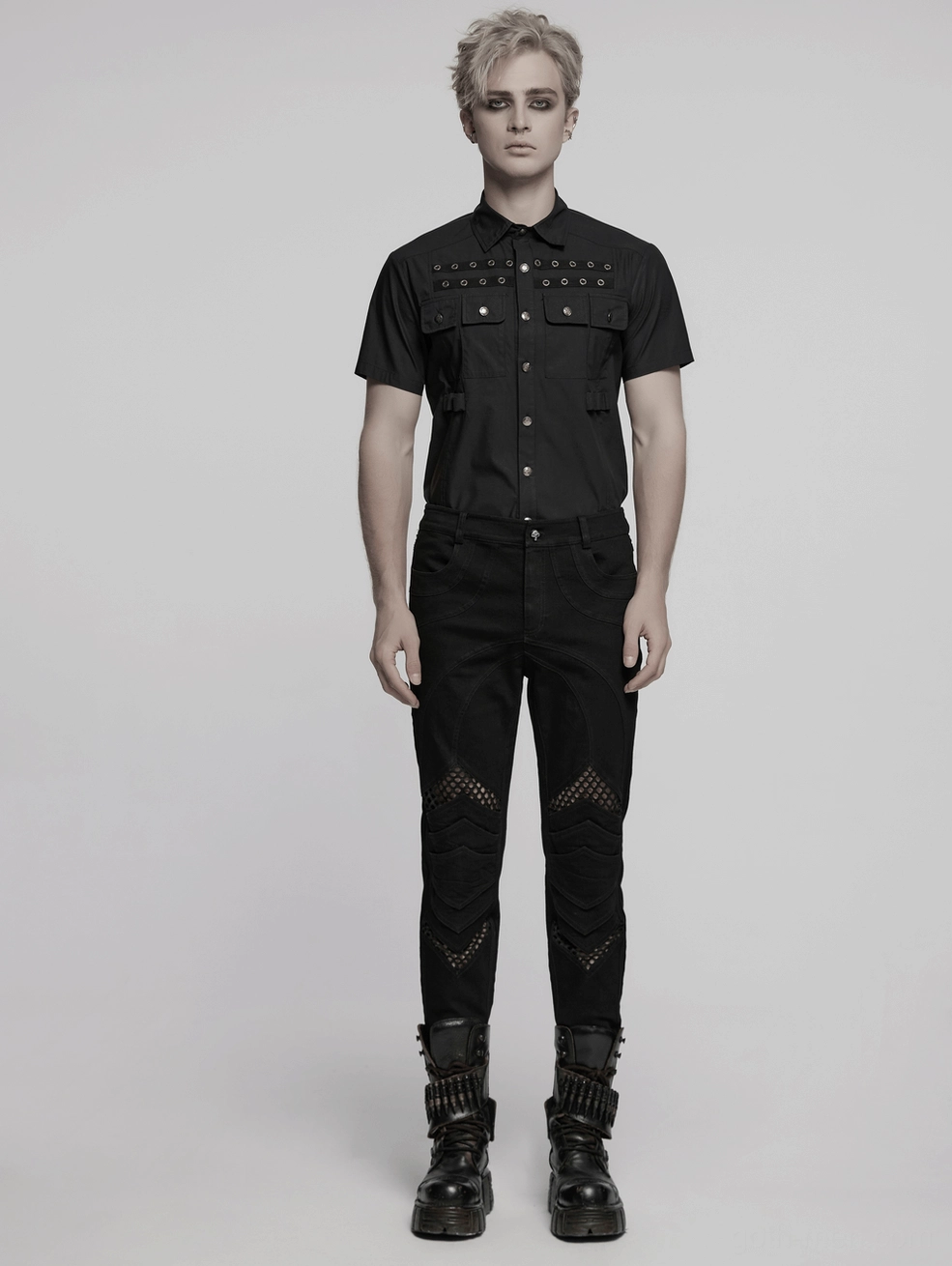 Black gothic mesh knee pants structural design detail showing geometric stitching and innovative knee architecture