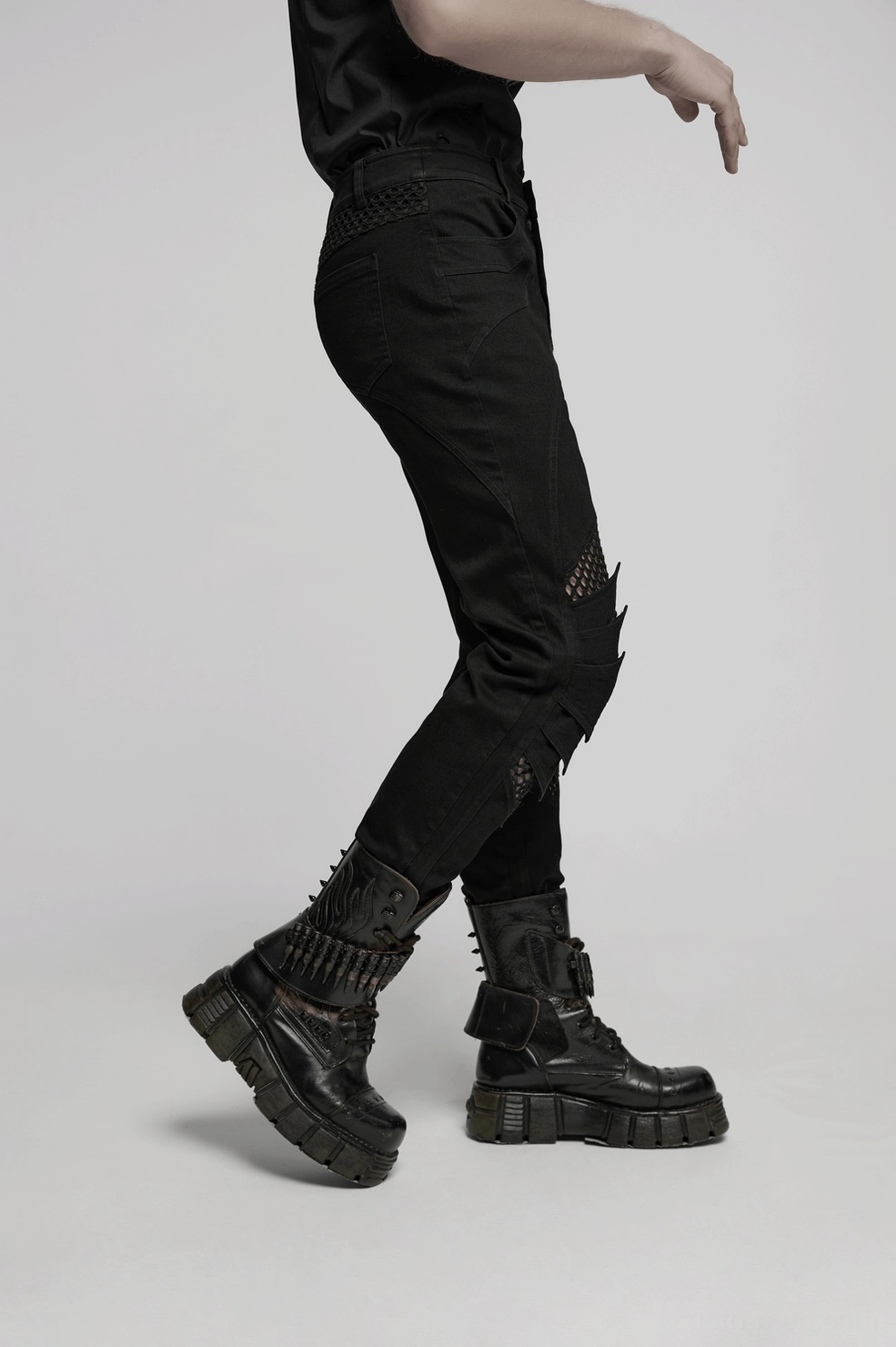 Black gothic mesh knee pants styling inspiration shot showing fitted silhouette and avant-garde mesh cutout design