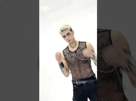 Close-up front view of black gothic mesh tank top showing transparent fabric and chain decorations