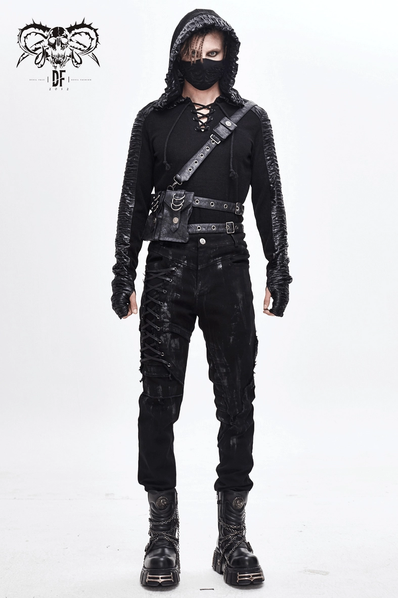 Frontal detail shot of black gothic pants lace-up system and distressed paint splatter effect