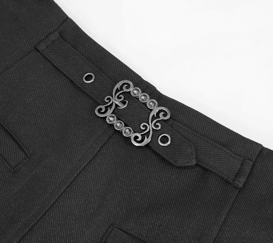 Close-up of black gothic pants waistband showing vintage metal buckle hardware and twill fabric texture