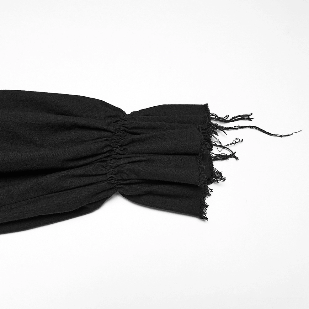 Macro close-up of black gothic poet shirt cuff showing raw frayed edge and gathered detail