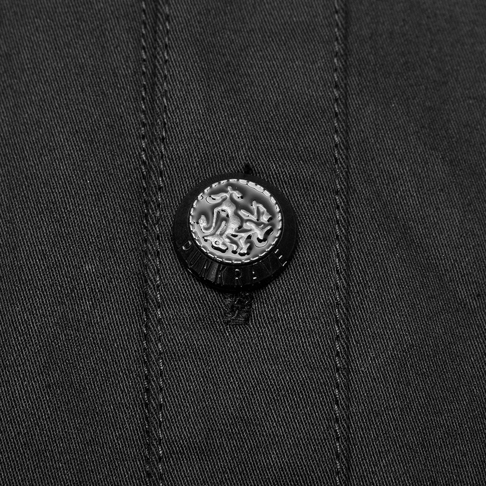 Detailed close-up of black gothic punk shirt metal button fastening and reinforced seam stitching