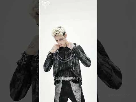 Black gothic punk hooded top with metal chain decorations half-body shot on blonde male model