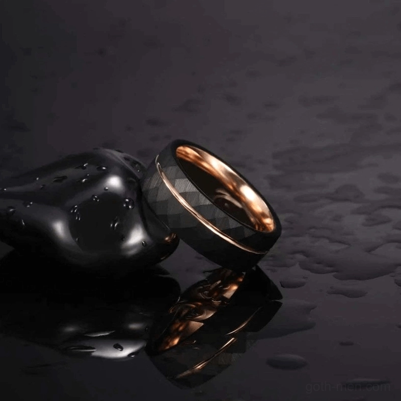 Black tungsten gothic rhombus ring paired with decorative stone, wet reflective background