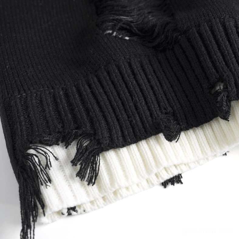 Gothic sweater hem double-layer detail with black frayed edge and white inner trim - distressed hem close-up