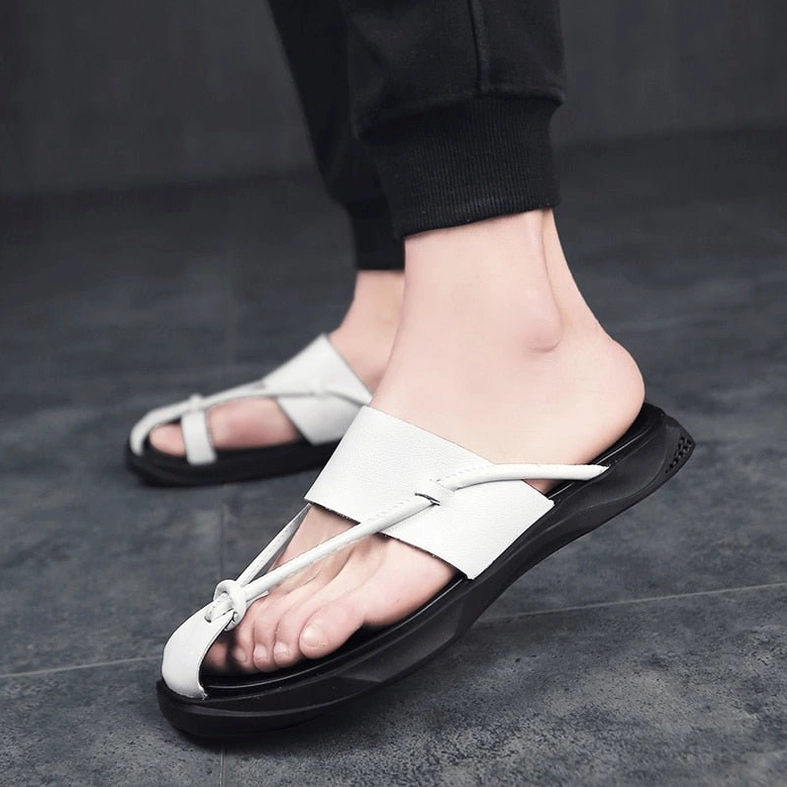Top view of gothic slip-on sandals displaying overall silhouette and minimalist design aesthetic