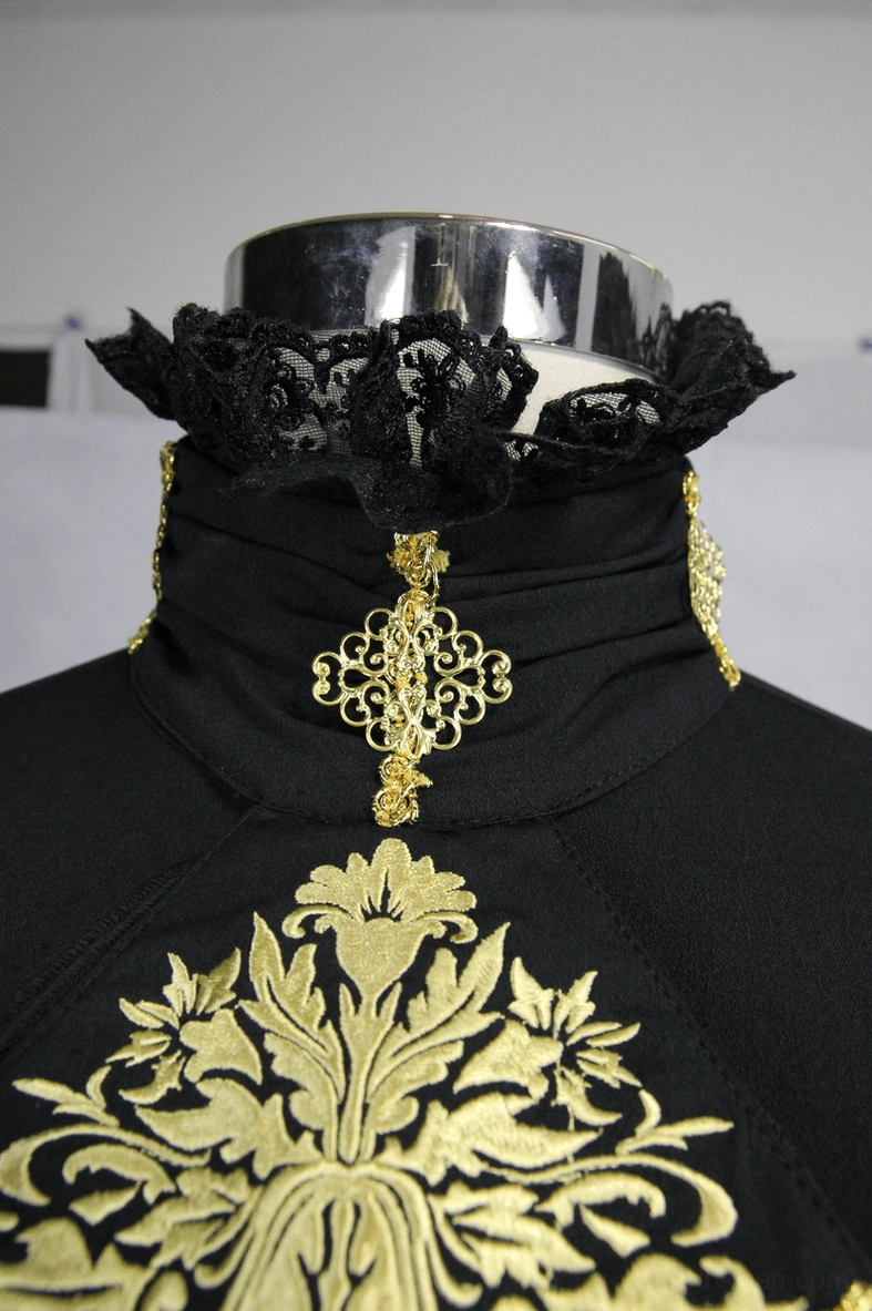 Close-up of black lace stand collar with gold baroque embroidery and ruffled neck decoration on gothic shirt