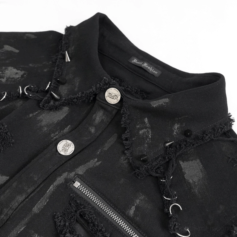Close-up detail of gothic shirt collar and placket featuring metal spike trims, metal C-ring accents, and branded metal buttons