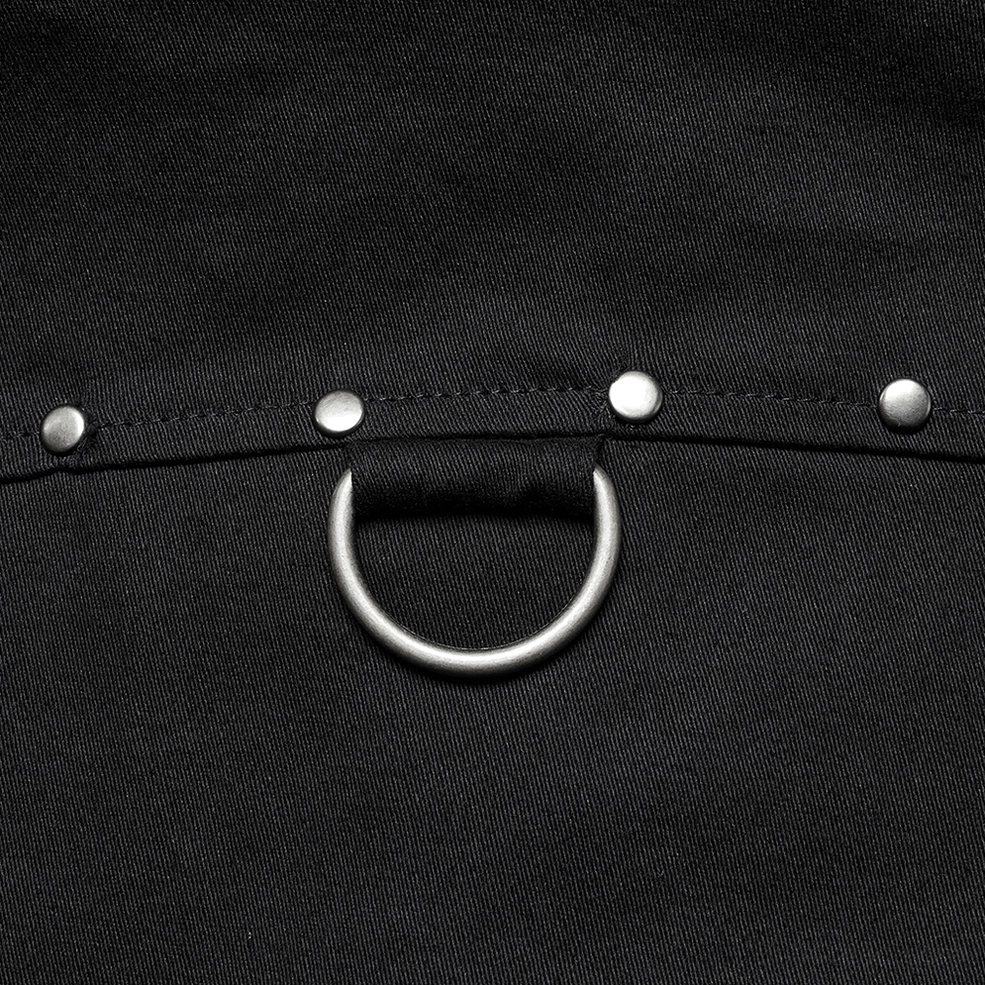 Close-up macro of black gothic twill fabric weave and metal studs D-ring hardware punk-gothic accent details