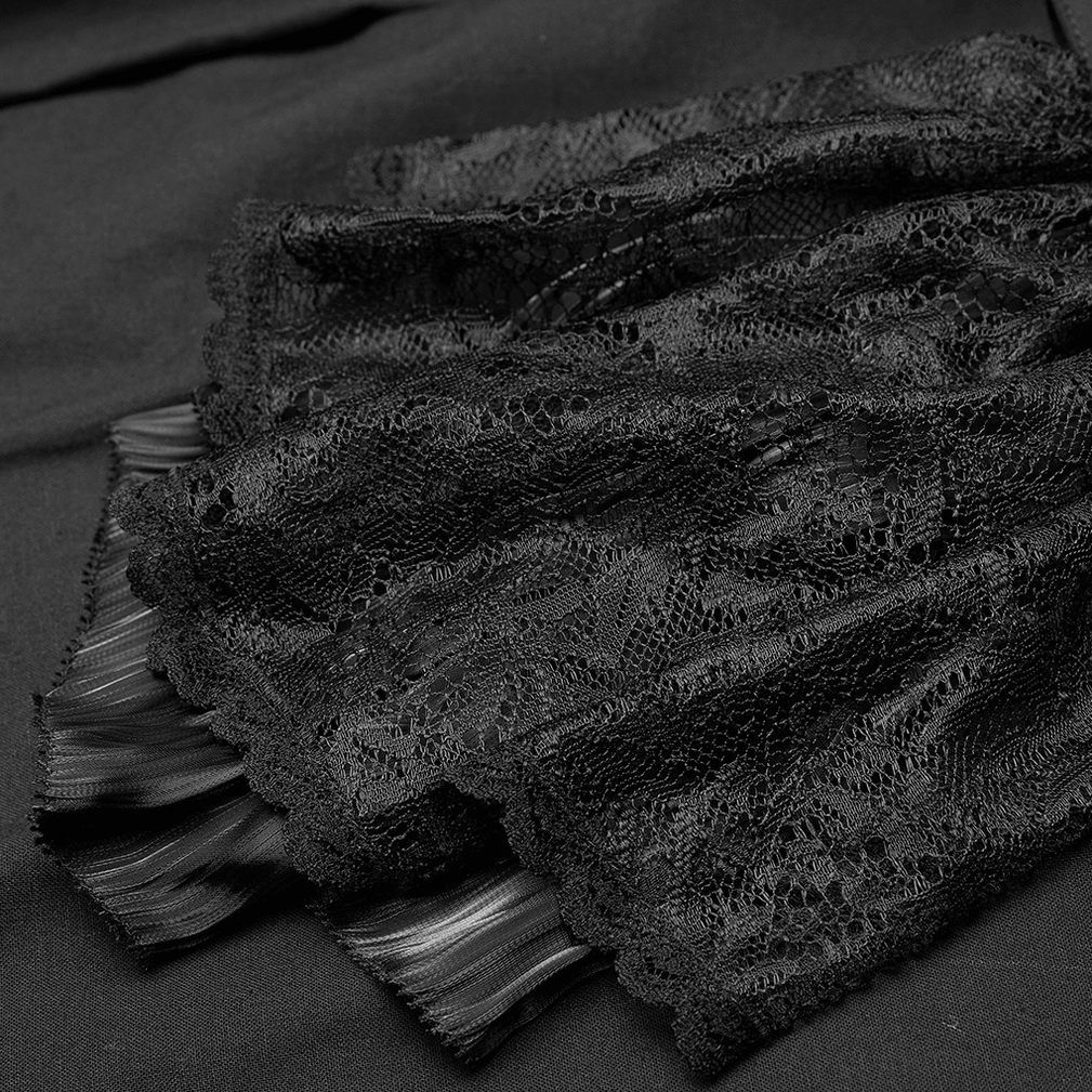 Macro detail of delicate black lace jabot ruffles on gothic cotton shirt